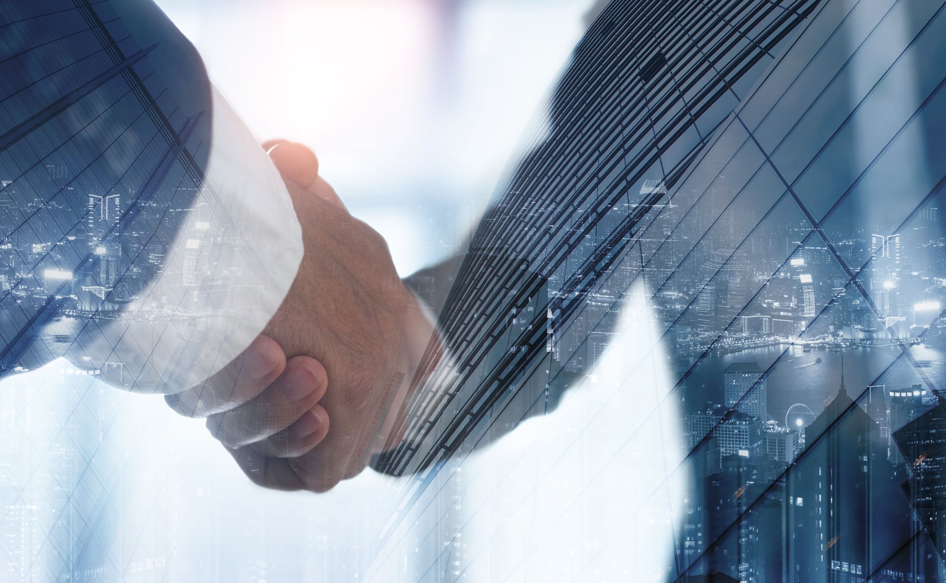 Double exposure of business handshake for successful of investment deal and the city, business teamwork and partnership concept. Businessmen making a handshake, business finanace and investment background